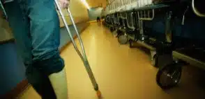 Man walking with crutches