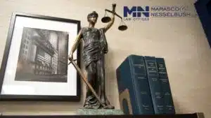 A statue of Lady Justice seated on a shelf, symbolizing fairness and impartiality
