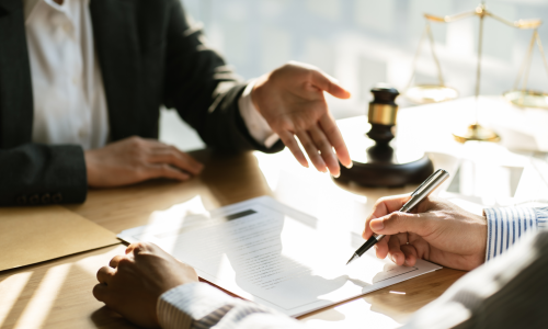 Image featuring legal professionals in a meeting.