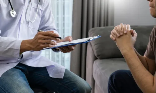 a-person-talking-to-a-doctor-in-rhode-island-after-a-back-injury