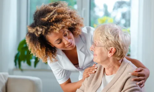 nursing-home-staff-talking-to-an-elderly-woman